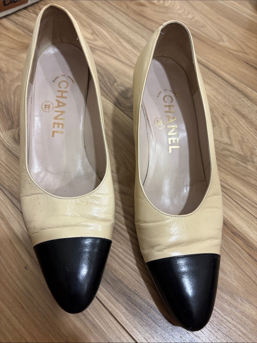 CHANEL Beige Leather Pumps with Black Cap Toe